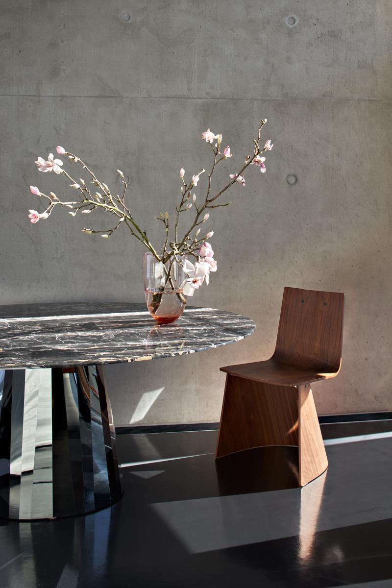 https://a.1stdibscdn.com/wooden-chair-classicon-venus-chair-design-konstantin-grcic-walnut-for-sale-picture-3/f_105752/f_487419621770721432588/ClassiCon_pli_table_nero_portoro_shia_vase_venus_chair_photo_hassos_master.jpg