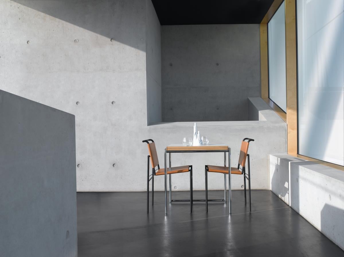 https://a.1stdibscdn.com/chair-in-leather-classicon-roquebrune-chair-design-eileen-gray-for-sale-picture-6/f_105752/f_487268521770653641017/ClassiCon_roquebrune_chair_cognac_jean_table_photo_popinger_master.jpg
