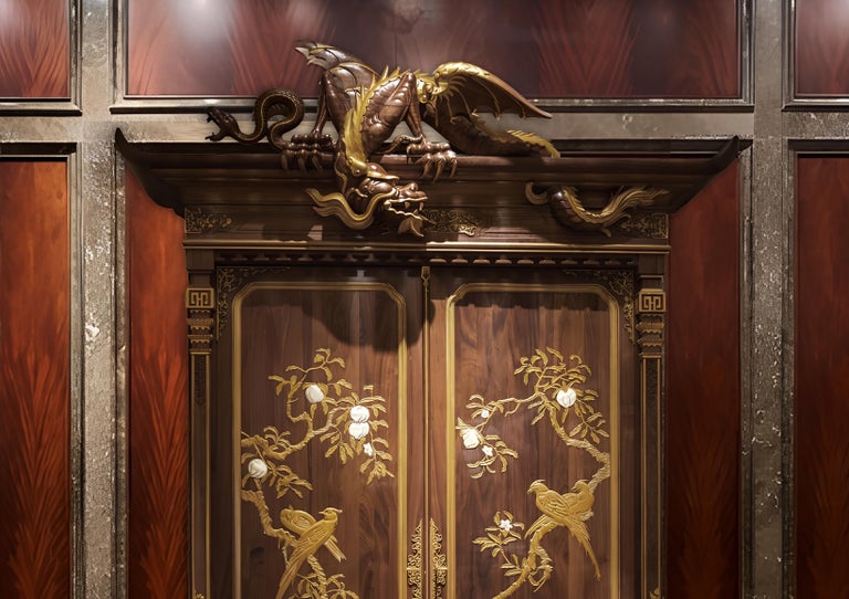 https://a.1stdibscdn.com/museum-quality-chinoiserie-rosewood-cabinet-with-dragon-and-paradise-bird-for-sale-picture-6/f_98702/f_488207721773395921001/Close_up_of_a_majestic_dragon_hand_carved_from_solid_rosewood_symbolizing_power_and_strength_on_the_cabinet_s_exterior_master.jpg?width=768
