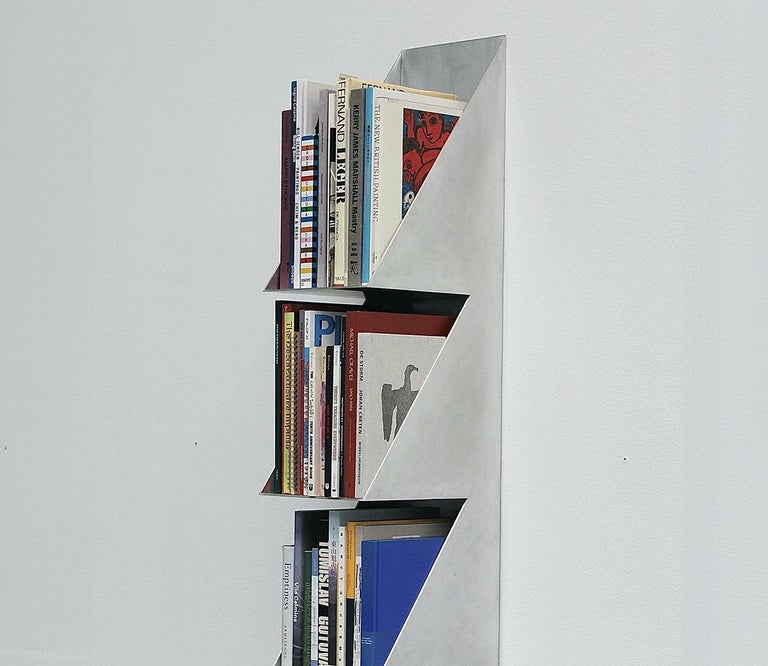https://a.1stdibscdn.com/1234567-aluminum-bookshelf-by-clay-brown-for-sale-picture-6/f_37133/f_437856321740428310898/CloseupBooks_master.jpg?width=768