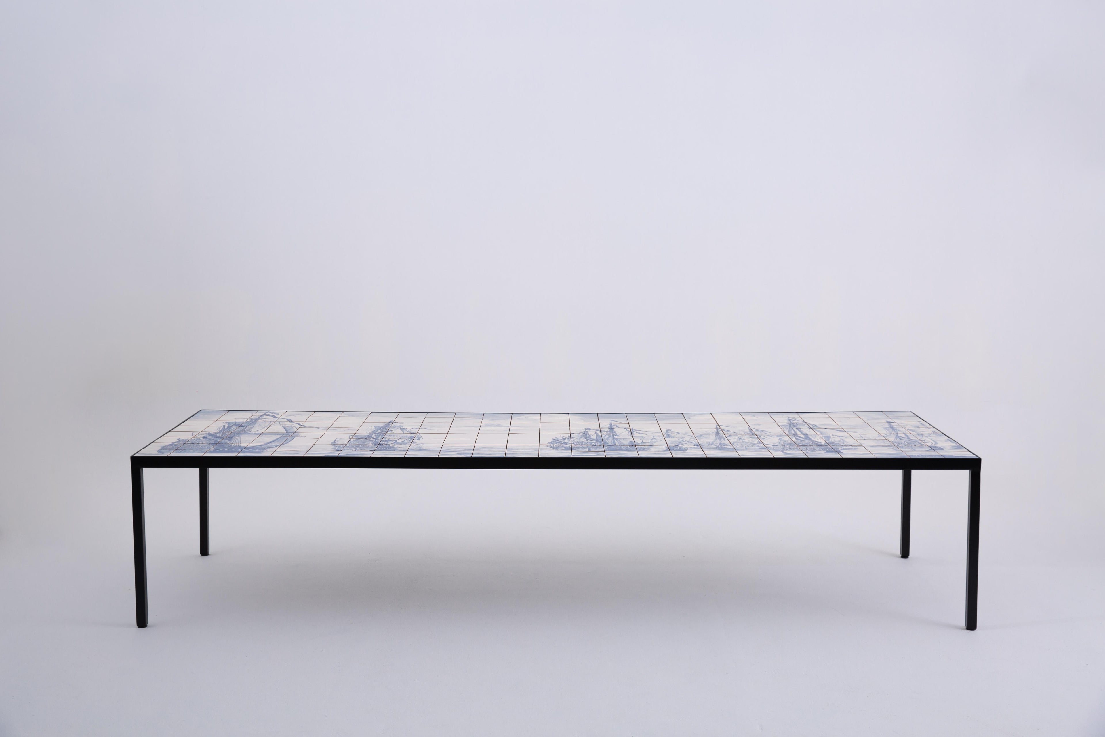 https://a.1stdibscdn.com/mesa-portuguesa-com-certeza-by-marcio-kogan-hand-painted-tile-metal-table-for-sale-picture-2/f_104502/f_451537321748008049529/Co_pia_de_55_30OUT2020_276_master.jpg