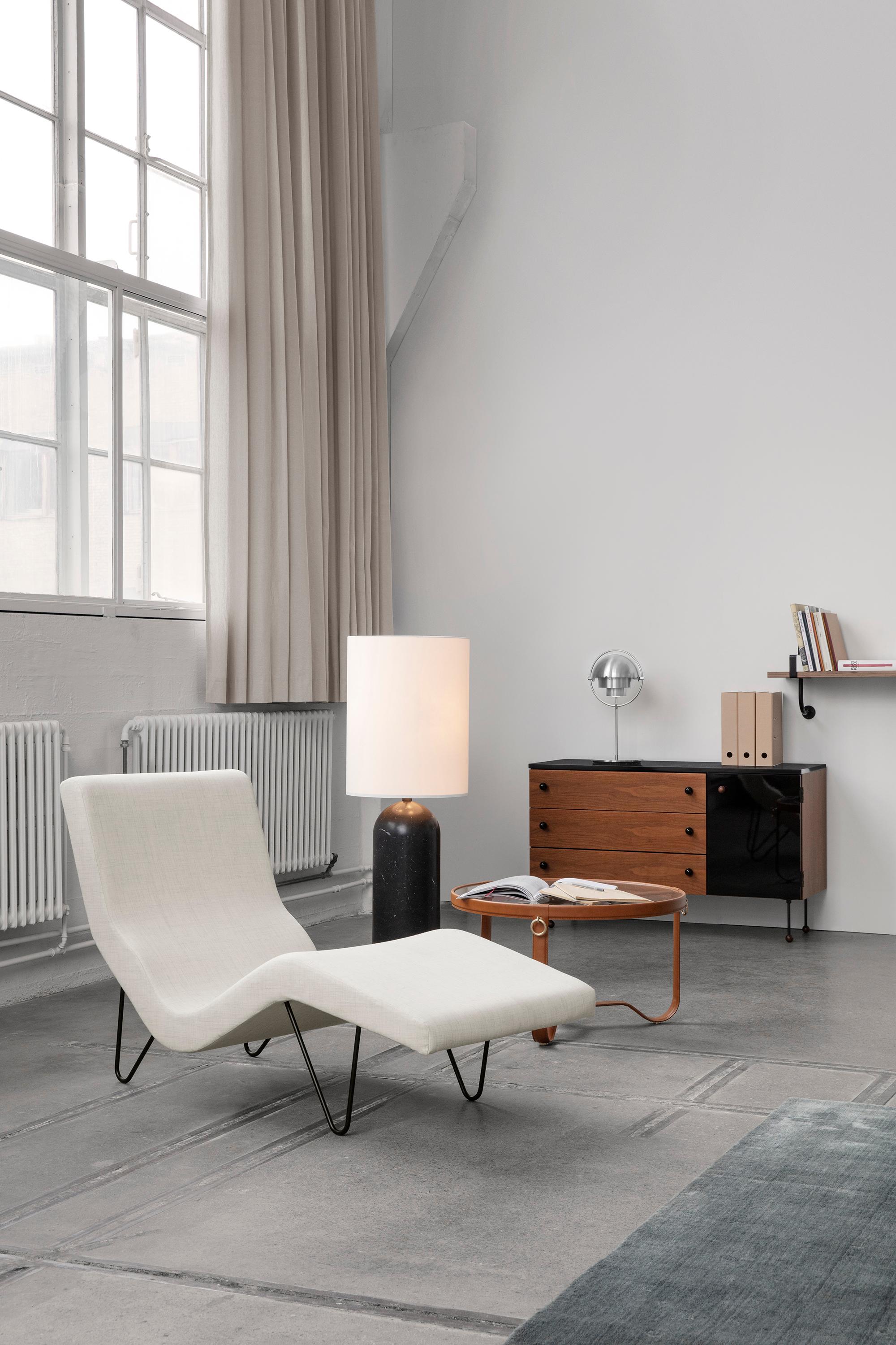 https://a.1stdibscdn.com/large-jacques-adnet-circulaire-glass-and-cream-leather-coffee-table-for-gubi-for-sale-picture-6/f_14472/f_365633321697038511727/Contract_GMGLoungeChair_GravityFloorLampXL_AdnetCoffeeTable_Multi_LiteTableLamp_62Dresser_DemonShelf_On_master.jpg