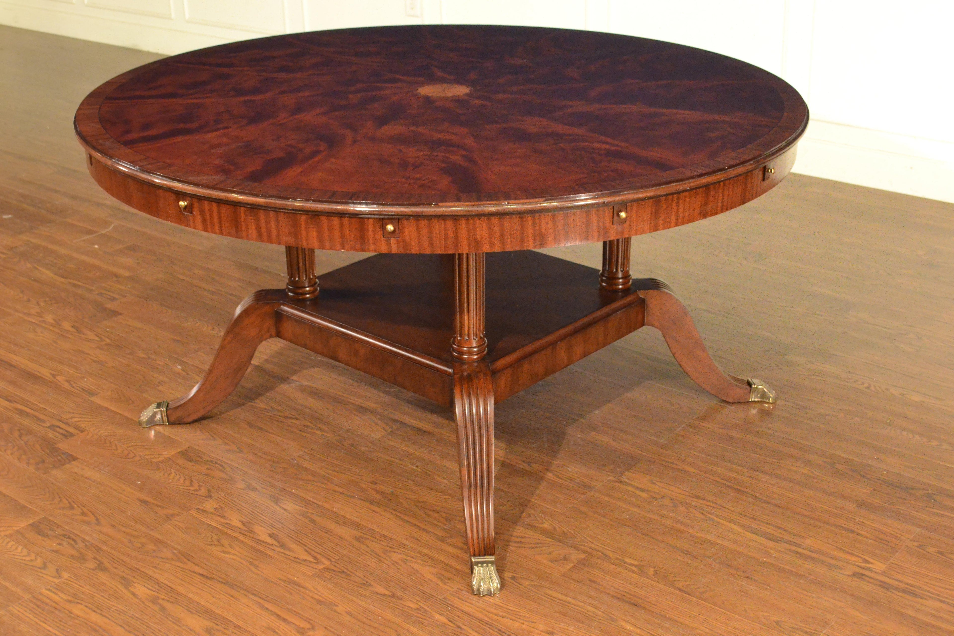 https://a.1stdibscdn.com/large-round-perimeter-leaf-mahogany-georgian-style-dining-table-by-leighton-hall-for-sale-picture-8/f_44162/f_146972821557705975255/D0603009_B2C6_48DA_8705_3C4675A96929_master.jpeg