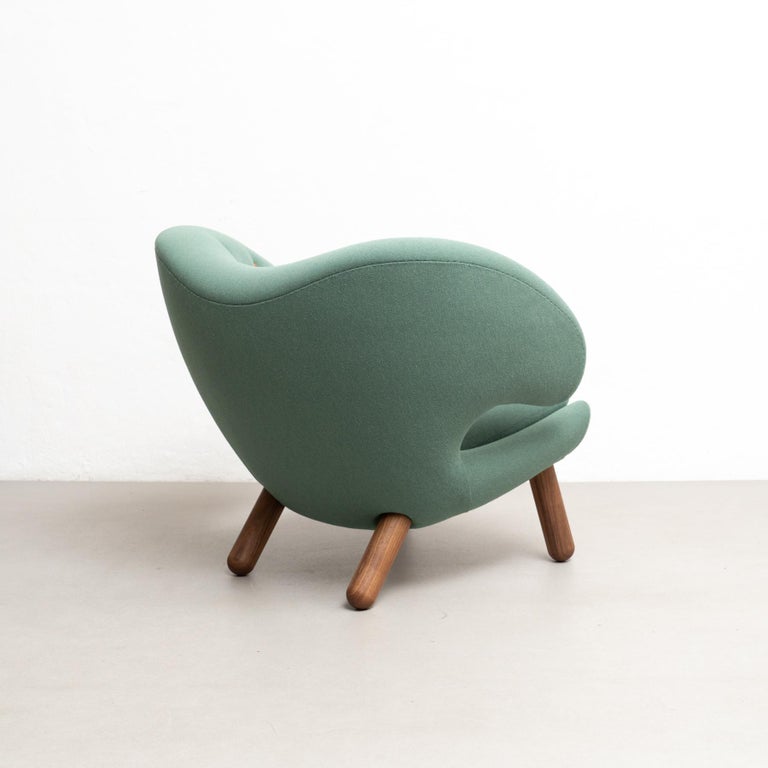https://a.1stdibscdn.com/finn-juhl-pelican-chair-upholstered-in-wood-and-fabric-for-sale-picture-7/f_14272/f_415623121726834600435/DADA280524_152_master.jpg?width=768