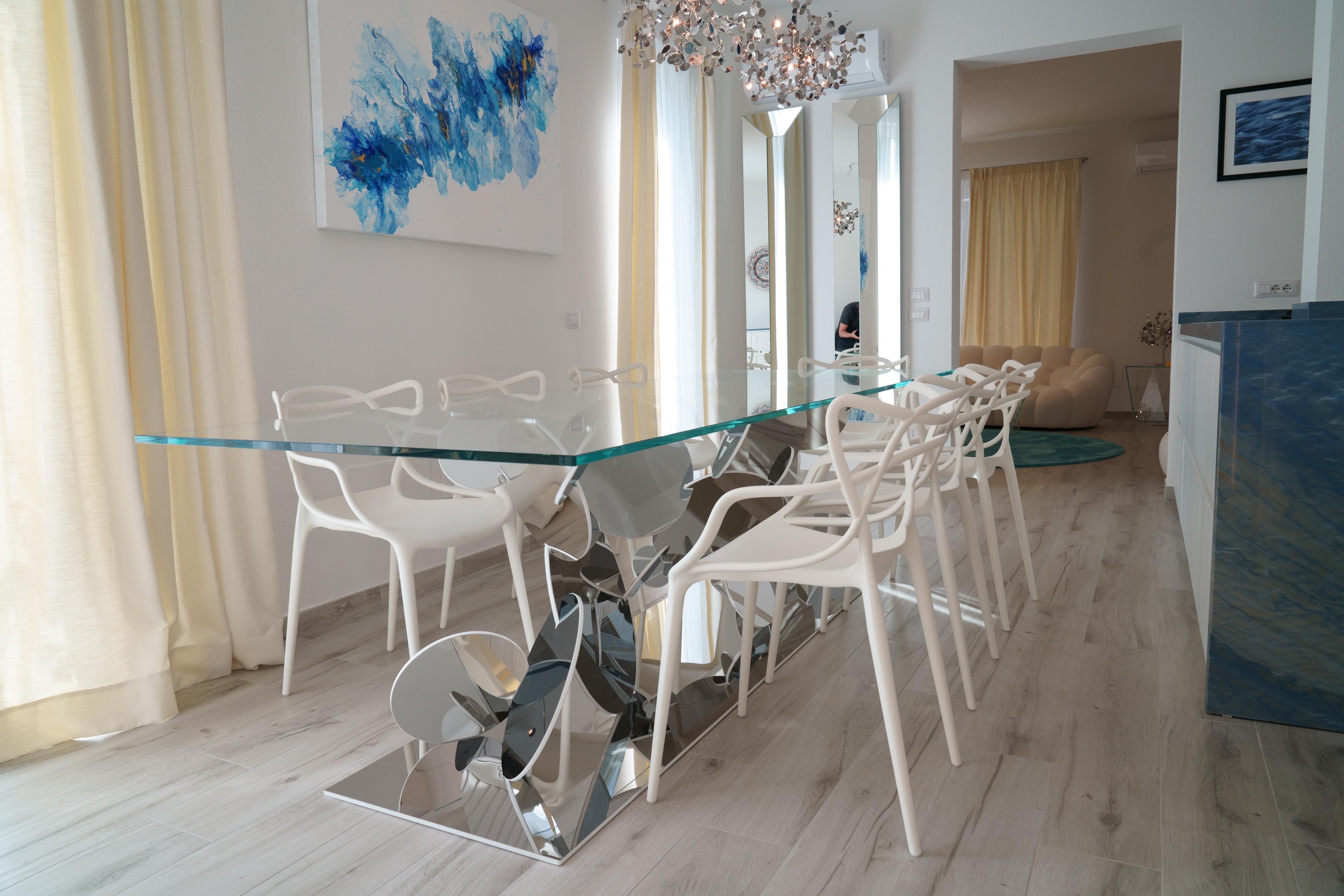 https://a.1stdibscdn.com/dining-table-tempered-glass-top-stainless-steel-mirror-finish-base-collectible-for-sale-picture-5/f_22003/f_302743721662362169404/DSC08114_master.jpg