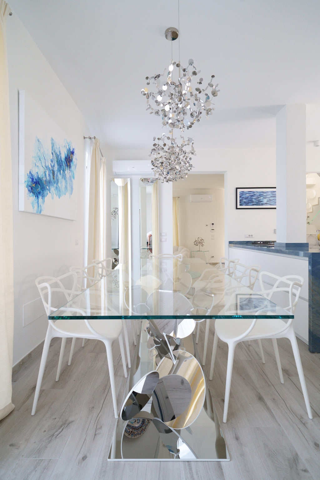 https://a.1stdibscdn.com/dining-table-tempered-glass-top-stainless-steel-mirror-finish-base-collectible-for-sale-picture-9/f_22003/f_302743721662362173057/DSC09226_master.jpg