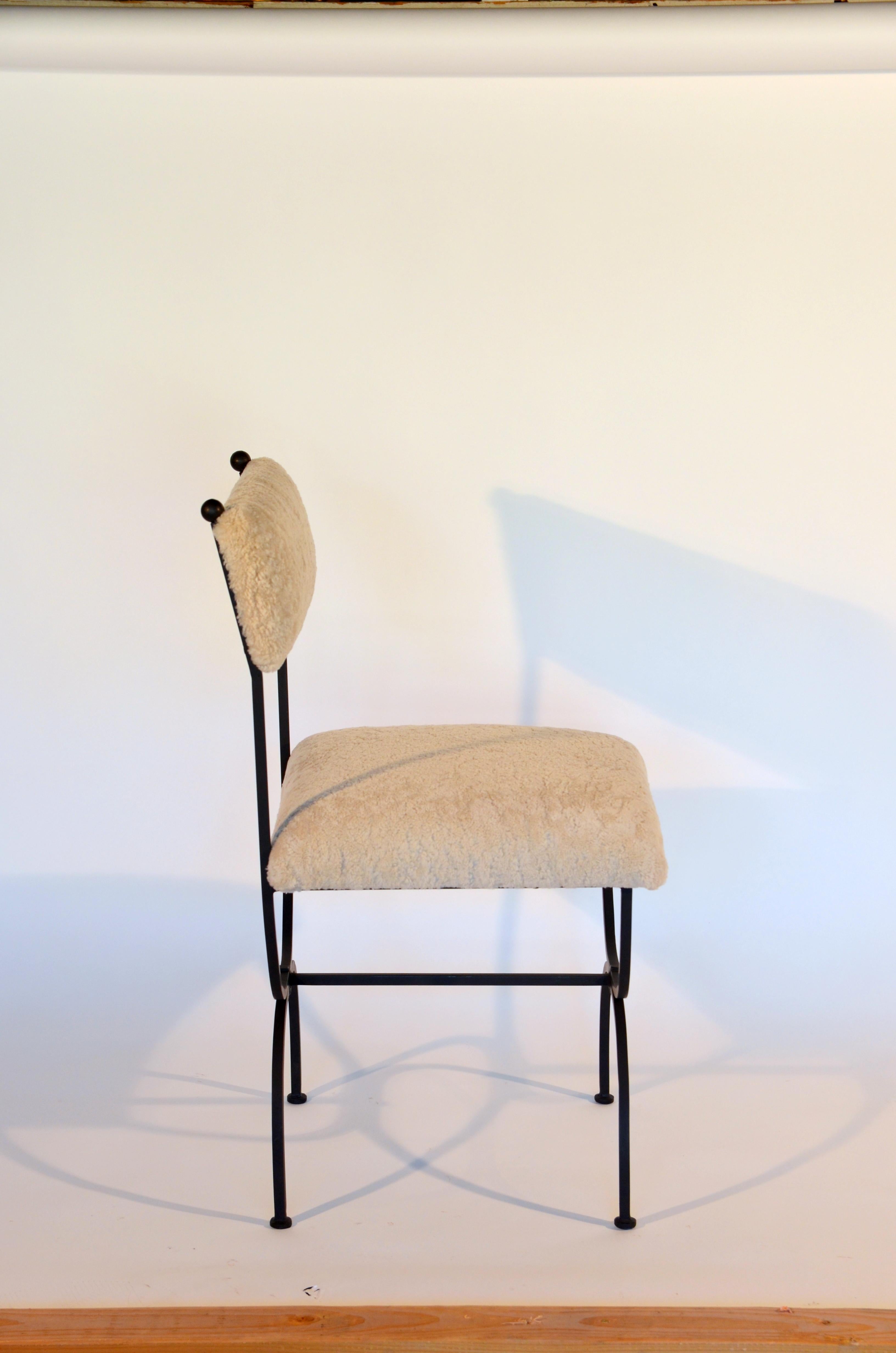 https://a.1stdibscdn.com/pair-of-chic-arcade-wrought-iron-and-shearling-chairs-by-design-freres-for-sale-picture-5/f_8184/f_222186221611307553994/DSC_0008_master.JPG