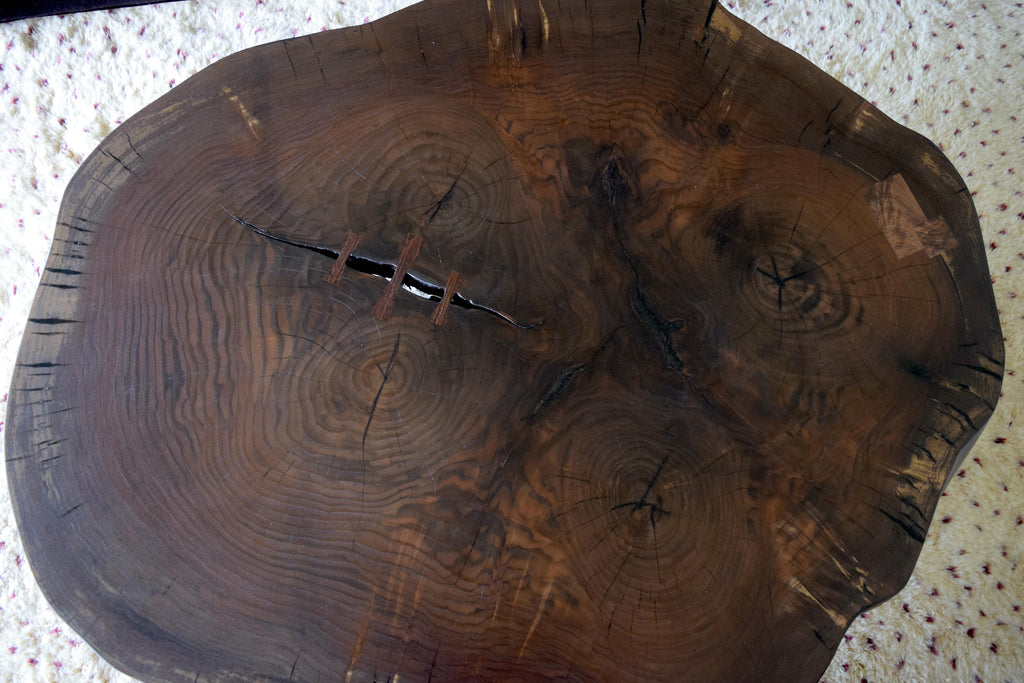 https://a.1stdibscdn.com/modern-cookie-slab-coffee-table-with-large-turned-legs-and-wenge-butterflies-for-sale-picture-2/f_36023/f_468315321758912023968/DSC_0606_master.JPG