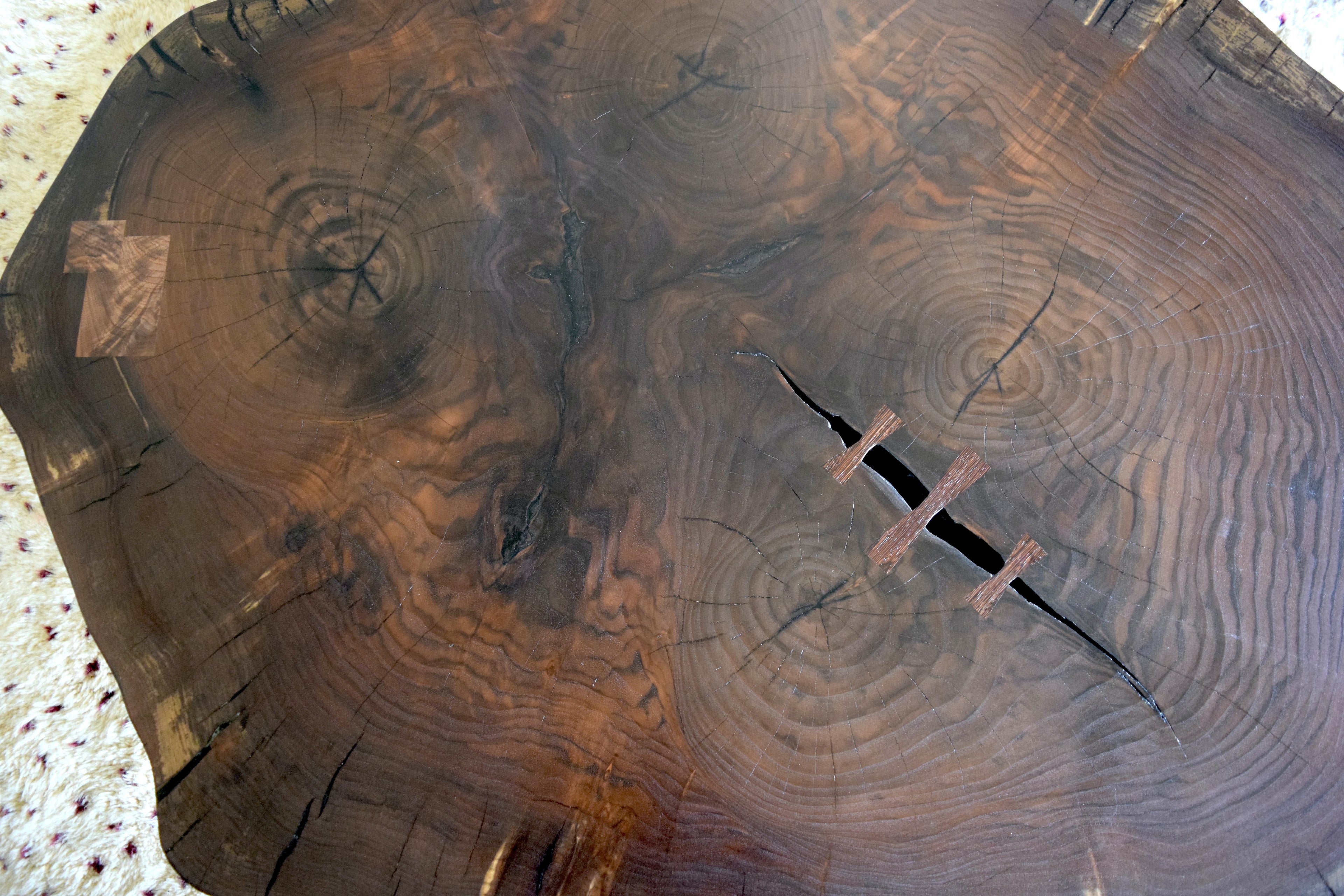 https://a.1stdibscdn.com/modern-cookie-slab-coffee-table-with-large-turned-legs-and-wenge-butterflies-for-sale-picture-3/f_36023/f_468315321758912025087/DSC_0608_master.JPG