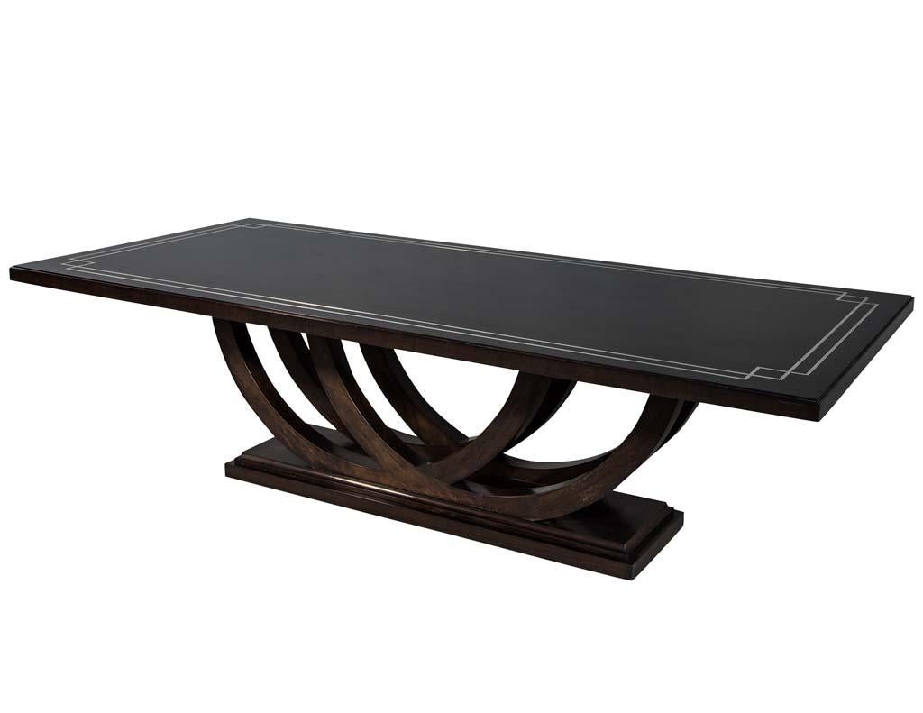 https://a.1stdibscdn.com/custom-walnut-dining-table-with-polished-metal-inlay-details-and-curved-base-for-sale-picture-2/f_8849/1553116287448/DS_5097_002_master.jpg