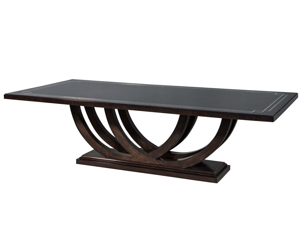 https://a.1stdibscdn.com/custom-walnut-dining-table-with-polished-metal-inlay-details-and-curved-base-for-sale-picture-4/f_8849/1553116287853/DS_5097_004_master.jpg