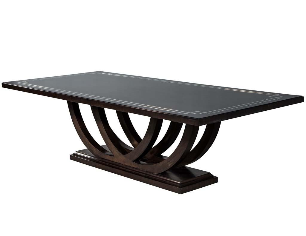 https://a.1stdibscdn.com/custom-walnut-dining-table-with-polished-metal-inlay-details-and-curved-base-for-sale-picture-5/f_8849/1553116287828/DS_5097_005_master.jpg