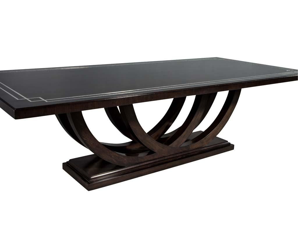 https://a.1stdibscdn.com/custom-walnut-dining-table-with-polished-metal-inlay-details-and-curved-base-for-sale-picture-10/f_8849/1553116288803/DS_5097_010_master.jpg
