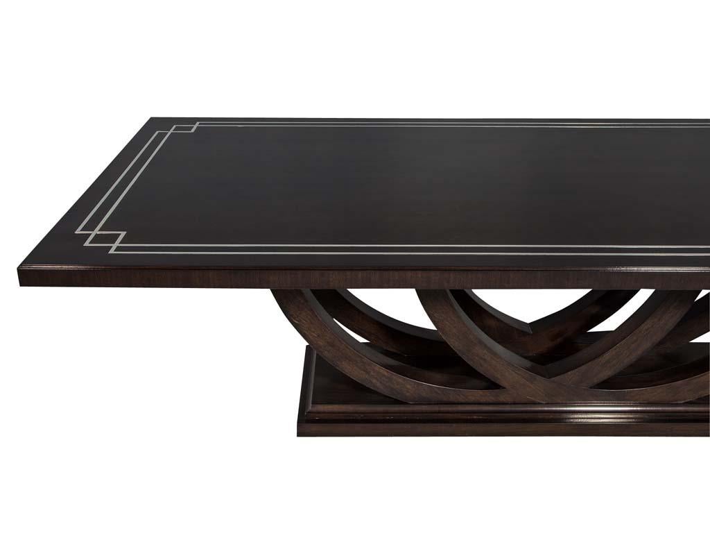 https://a.1stdibscdn.com/custom-walnut-dining-table-with-polished-metal-inlay-details-and-curved-base-for-sale-picture-13/f_8849/1553116288123/DS_5097_013_master.jpg