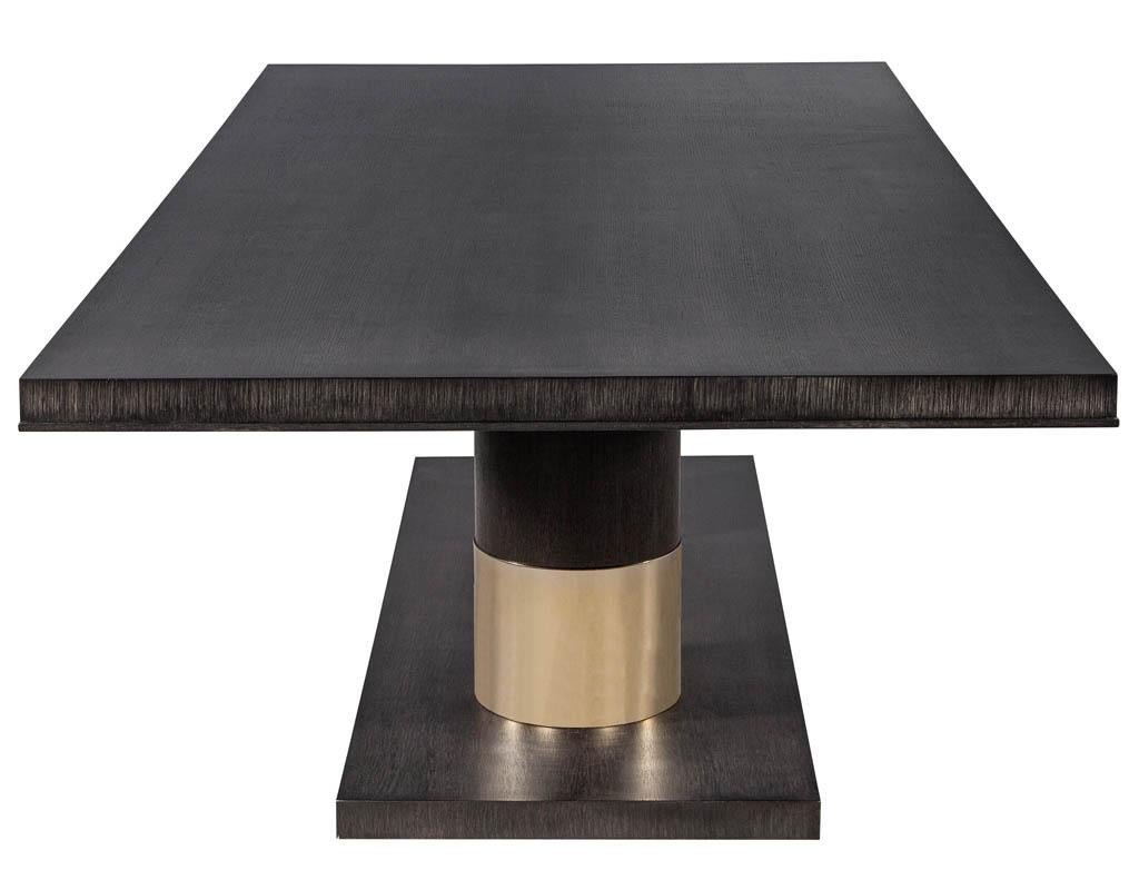 https://a.1stdibscdn.com/modern-oak-dining-table-with-double-column-champagne-ring-base-for-sale-picture-10/f_8849/1593197723881/DS_5123_Modern_Oak_Double_Pedestal_Brass_Ring_Dining_Table_0010_master.jpg