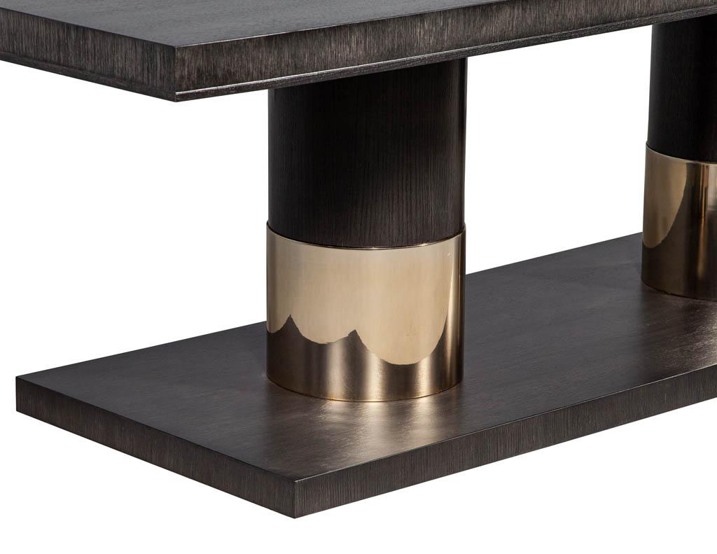 https://a.1stdibscdn.com/modern-oak-dining-table-with-double-column-champagne-ring-base-for-sale-picture-5/f_8849/1593197722101/DS_5123_Modern_Oak_Double_Pedestal_Brass_Ring_Dining_Table_005_master.jpg