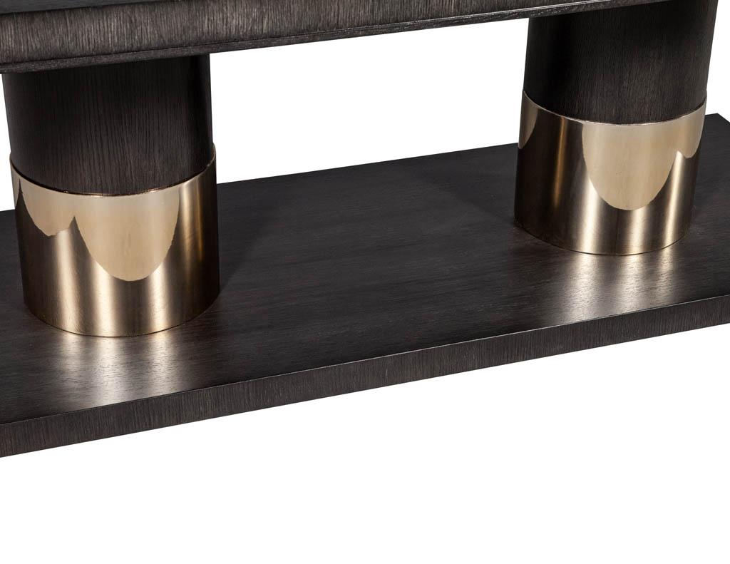 https://a.1stdibscdn.com/modern-oak-dining-table-with-double-column-champagne-ring-base-for-sale-picture-7/f_8849/1593197722757/DS_5123_Modern_Oak_Double_Pedestal_Brass_Ring_Dining_Table_007_master.jpg