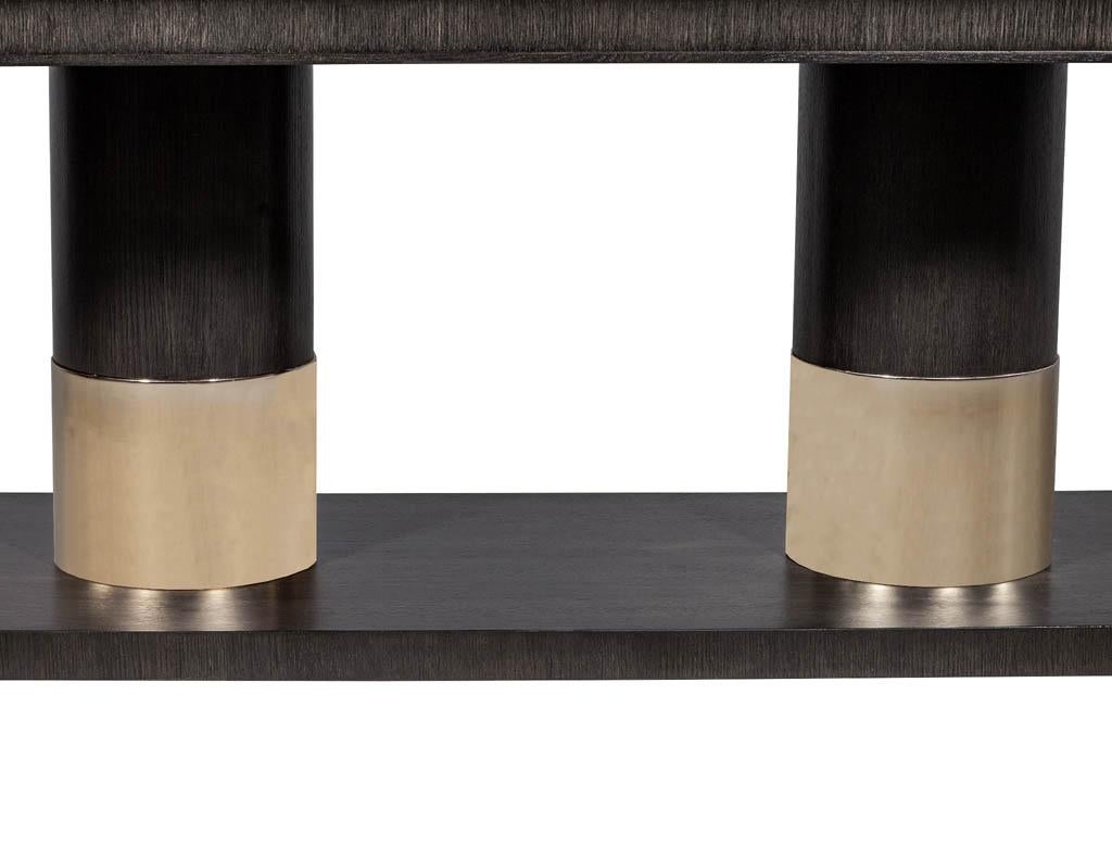 https://a.1stdibscdn.com/modern-oak-dining-table-with-double-column-champagne-ring-base-for-sale-picture-8/f_8849/1593197723036/DS_5123_Modern_Oak_Double_Pedestal_Brass_Ring_Dining_Table_008_master.jpg
