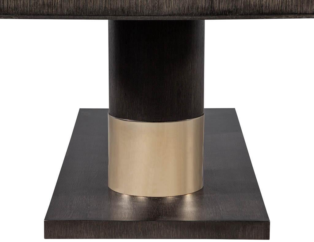 https://a.1stdibscdn.com/modern-oak-dining-table-with-double-column-champagne-ring-base-for-sale-picture-9/f_8849/1593197723418/DS_5123_Modern_Oak_Double_Pedestal_Brass_Ring_Dining_Table_009_master.jpg