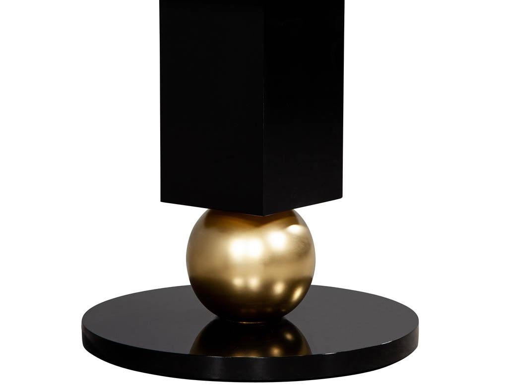 https://a.1stdibscdn.com/custom-modern-porcelain-black-dining-table-with-geometric-pedestals-for-sale-picture-11/f_8849/1611279737046/DS_5135_Custom_Modern_Porcelain_Black_Dining_Table_with_Gold_Leaf_Pedestals_0012_master.jpg