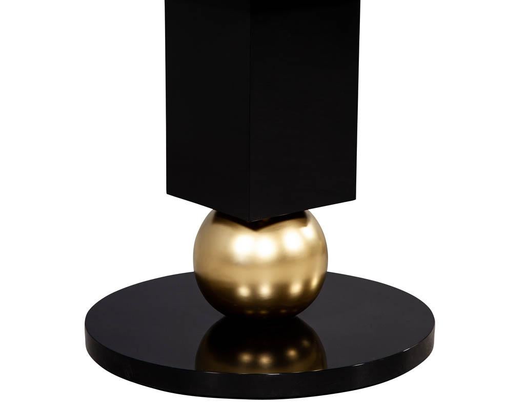 https://a.1stdibscdn.com/custom-modern-porcelain-black-dining-table-with-geometric-pedestals-for-sale-picture-12/f_8849/1611279737008/DS_5135_Custom_Modern_Porcelain_Black_Dining_Table_with_Gold_Leaf_Pedestals_0013_master.jpg