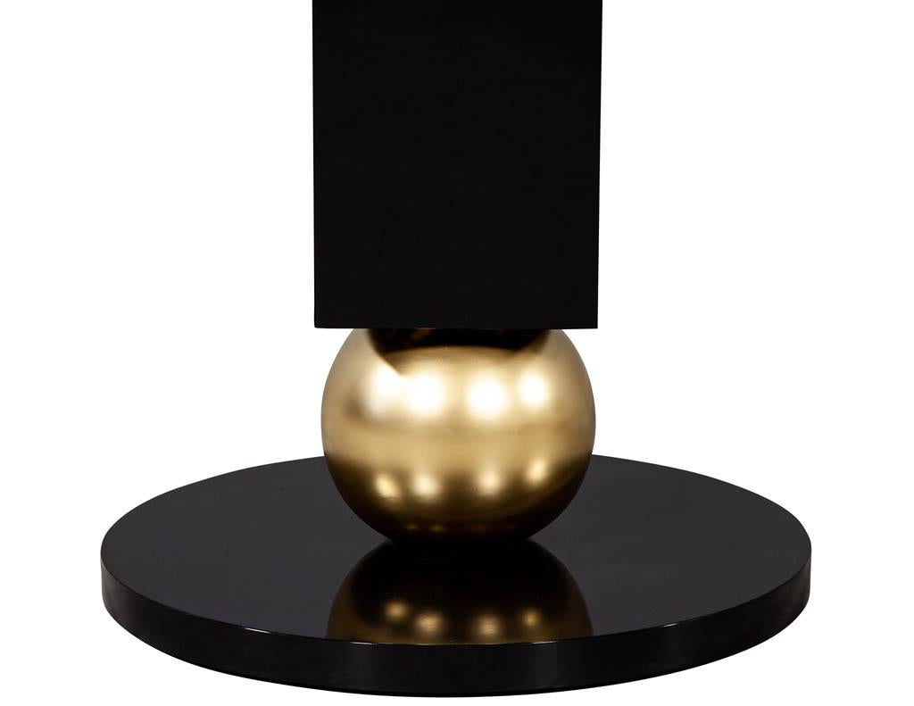 https://a.1stdibscdn.com/custom-modern-porcelain-black-dining-table-with-geometric-pedestals-for-sale-picture-13/f_8849/1611279737035/DS_5135_Custom_Modern_Porcelain_Black_Dining_Table_with_Gold_Leaf_Pedestals_0014_master.jpg