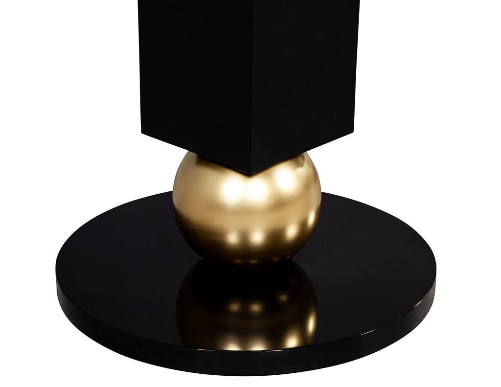 https://a.1stdibscdn.com/custom-modern-porcelain-black-dining-table-with-geometric-pedestals-for-sale-picture-14/f_8849/1611279737370/DS_5135_Custom_Modern_Porcelain_Black_Dining_Table_with_Gold_Leaf_Pedestals_0015_master.jpg