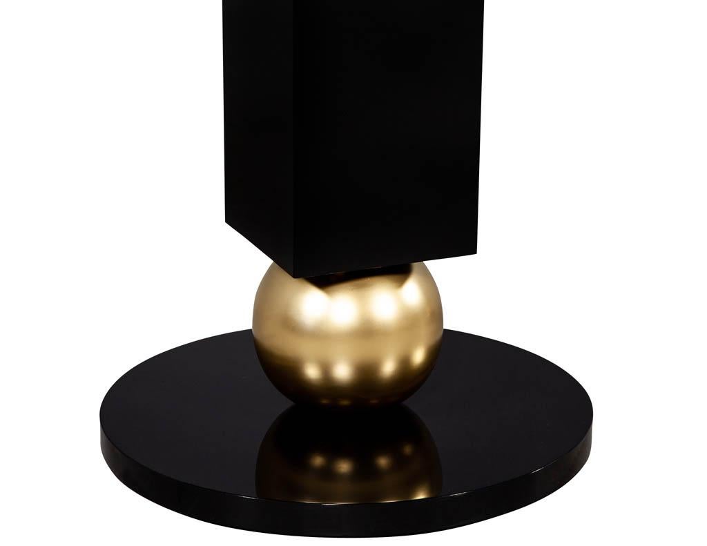 https://a.1stdibscdn.com/custom-modern-porcelain-black-dining-table-with-geometric-pedestals-for-sale-picture-15/f_8849/1611279737294/DS_5135_Custom_Modern_Porcelain_Black_Dining_Table_with_Gold_Leaf_Pedestals_0016_master.jpg