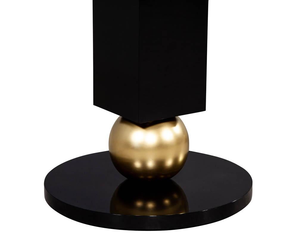 https://a.1stdibscdn.com/custom-modern-porcelain-black-dining-table-with-geometric-pedestals-for-sale-picture-16/f_8849/1611279737373/DS_5135_Custom_Modern_Porcelain_Black_Dining_Table_with_Gold_Leaf_Pedestals_0017_master.jpg