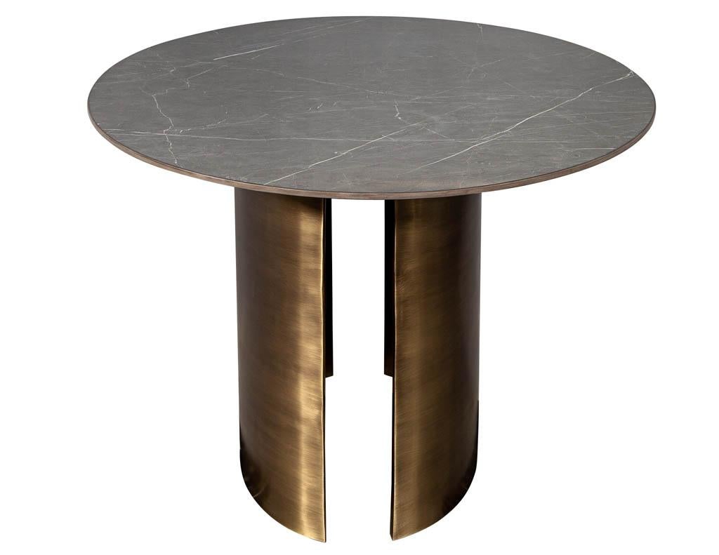 https://a.1stdibscdn.com/custom-oval-porcelain-top-dining-table-with-brass-demi-lune-base-by-carrocel-for-sale-picture-11/f_8849/1619713215069/DS_5157_Custom_Modern_Oval_Porcelain_Dining_Table_Brass_Base_0011_master.jpg
