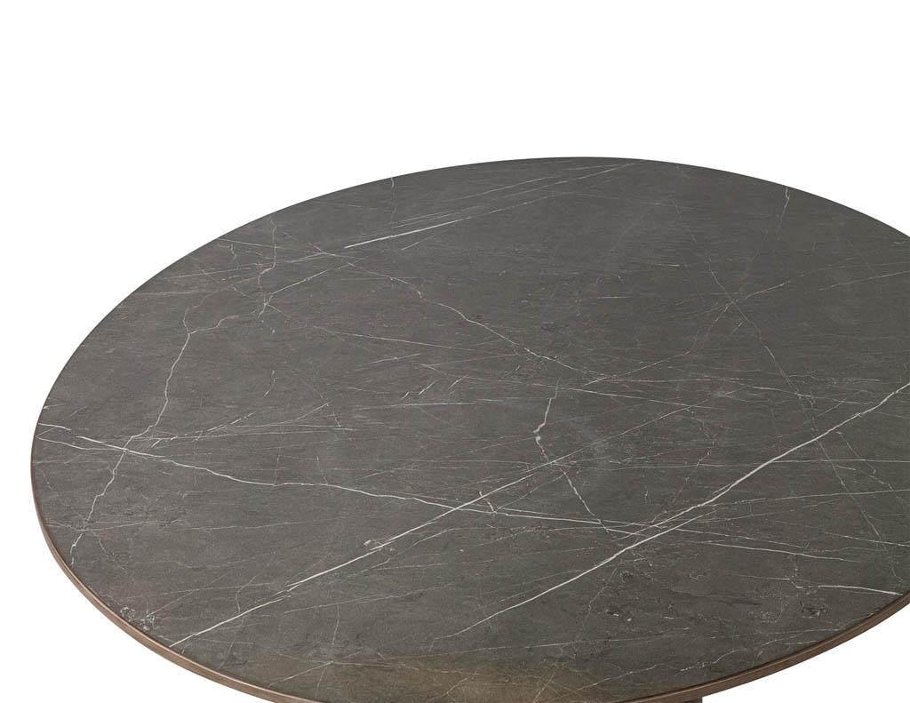 https://a.1stdibscdn.com/custom-oval-porcelain-top-dining-table-with-brass-demi-lune-base-by-carrocel-for-sale-picture-12/f_8849/1619713215413/DS_5157_Custom_Modern_Oval_Porcelain_Dining_Table_Brass_Base_0012_master.jpg