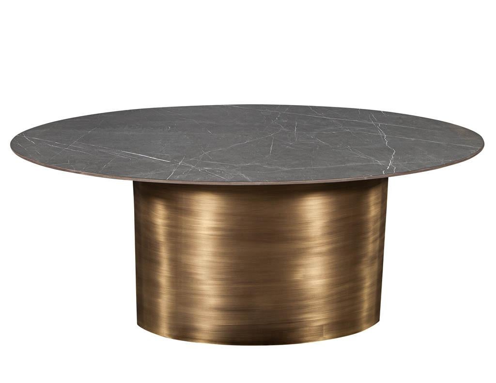 https://a.1stdibscdn.com/custom-oval-porcelain-top-dining-table-with-brass-demi-lune-base-by-carrocel-for-sale-picture-2/f_8849/1619713211857/DS_5157_Custom_Modern_Oval_Porcelain_Dining_Table_Brass_Base_002_master.jpg