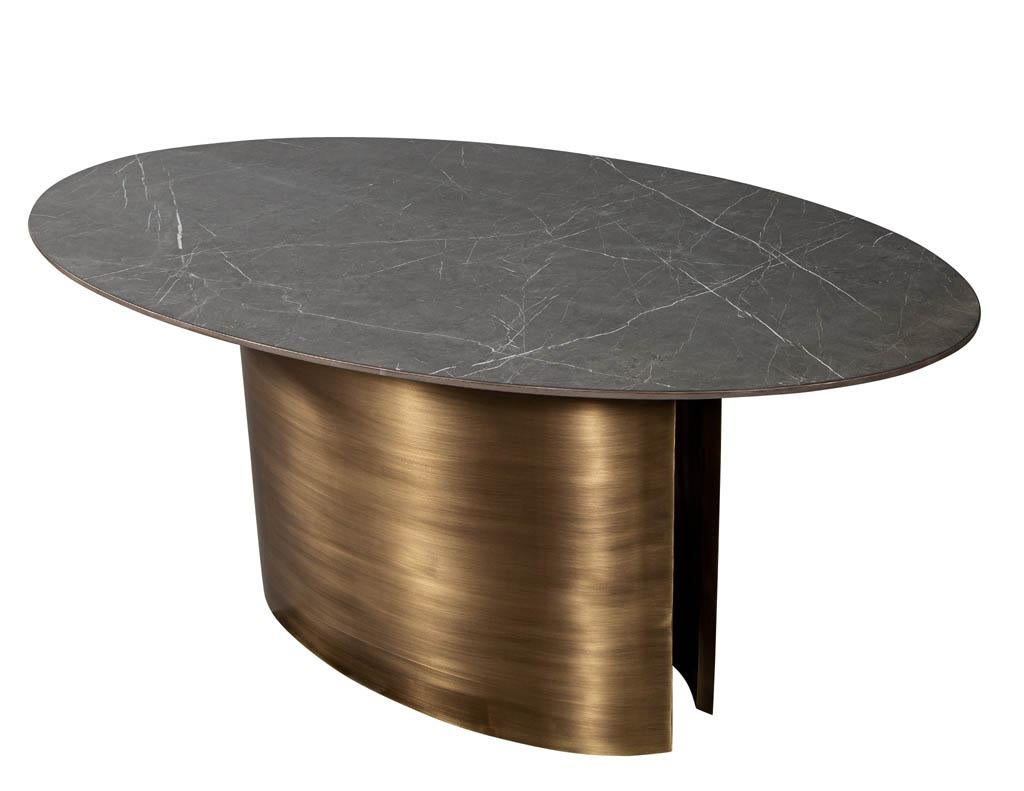 https://a.1stdibscdn.com/custom-oval-porcelain-top-dining-table-with-brass-demi-lune-base-by-carrocel-for-sale-picture-3/f_8849/1619713212240/DS_5157_Custom_Modern_Oval_Porcelain_Dining_Table_Brass_Base_003_master.jpg