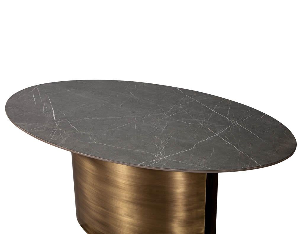 https://a.1stdibscdn.com/custom-oval-porcelain-top-dining-table-with-brass-demi-lune-base-by-carrocel-for-sale-picture-4/f_8849/1619713210670/DS_5157_Custom_Modern_Oval_Porcelain_Dining_Table_Brass_Base_004_master.jpg