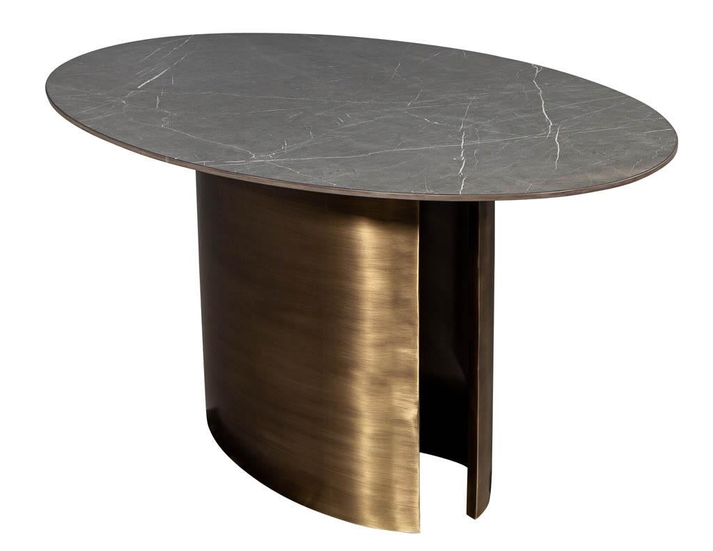 https://a.1stdibscdn.com/custom-oval-porcelain-top-dining-table-with-brass-demi-lune-base-by-carrocel-for-sale-picture-6/f_8849/1619713211518/DS_5157_Custom_Modern_Oval_Porcelain_Dining_Table_Brass_Base_006_master.jpg