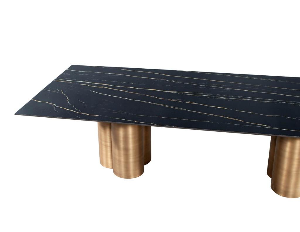 https://a.1stdibscdn.com/custom-modern-porcelain-dining-table-with-antiqued-brass-clover-pedestals-for-sale-picture-4/f_8849/f_312581421668120783380/DS_5211_Modern_Porcelain_Dining_Table_Antiqued_Brass_Clover_Pedestals_004_master.jpg