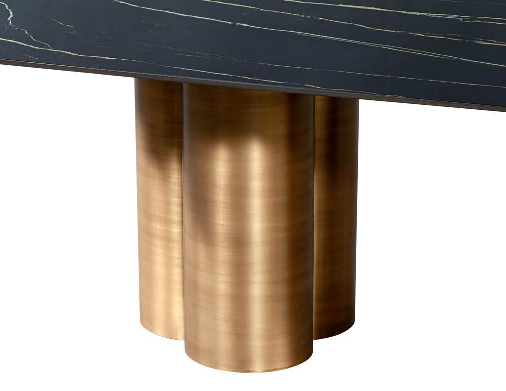 https://a.1stdibscdn.com/custom-modern-porcelain-dining-table-with-antiqued-brass-clover-pedestals-for-sale-picture-6/f_8849/f_312581421668120783385/DS_5211_Modern_Porcelain_Dining_Table_Antiqued_Brass_Clover_Pedestals_006_master.jpg