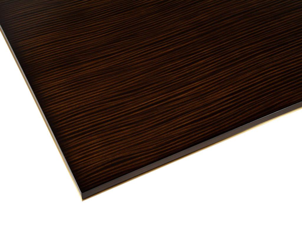 https://a.1stdibscdn.com/custom-walnut-dining-table-with-brass-details-for-sale-picture-5/f_8849/f_329189121677092745405/DS_5215_Carrocel_Custom_Walnut_Dining_Table_Brass_Details_005_master.jpg