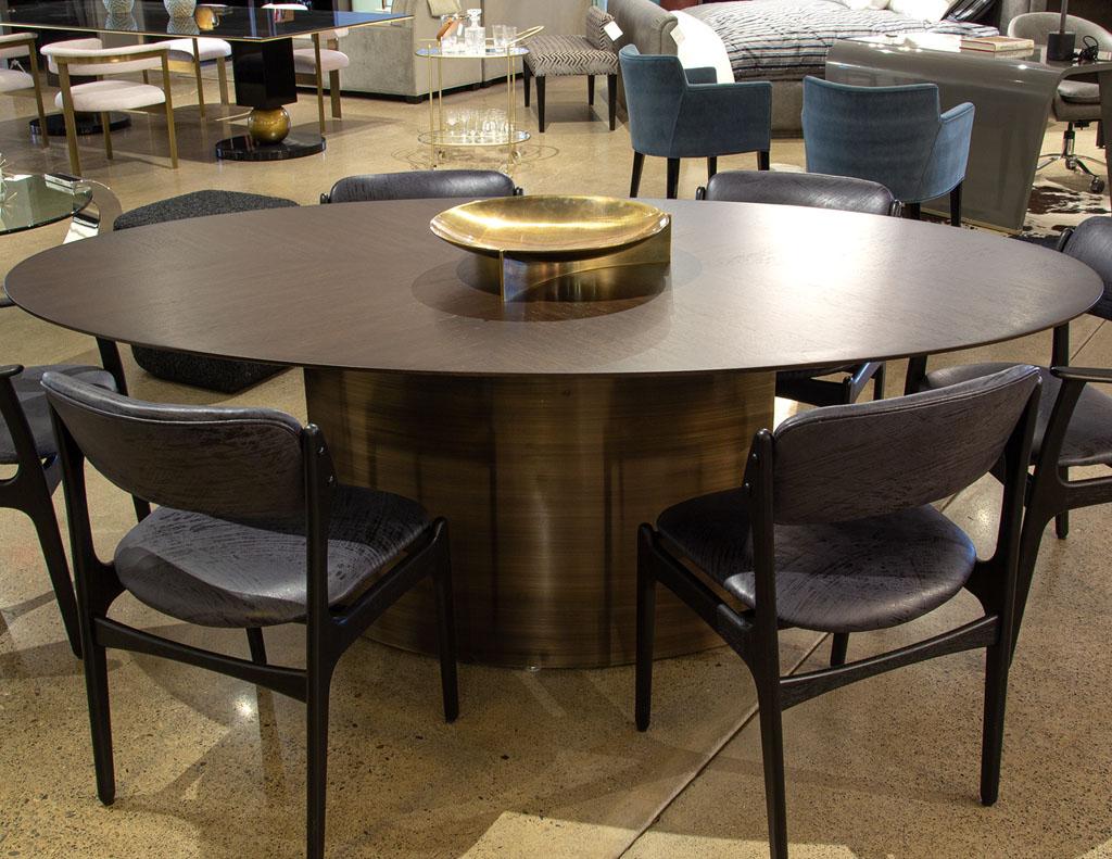 https://a.1stdibscdn.com/modern-oval-oak-dining-table-with-curved-metal-pedestals-for-sale-picture-12/f_8849/f_347313321686592221931/DS_5218_Modern_Oval_Oak_Dining_Table_Curved_Metal_Pedestals_0012_master.jpg