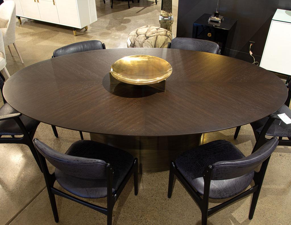 https://a.1stdibscdn.com/modern-oval-oak-dining-table-with-curved-metal-pedestals-for-sale-picture-13/f_8849/f_347313321686592221939/DS_5218_Modern_Oval_Oak_Dining_Table_Curved_Metal_Pedestals_0013_master.jpg