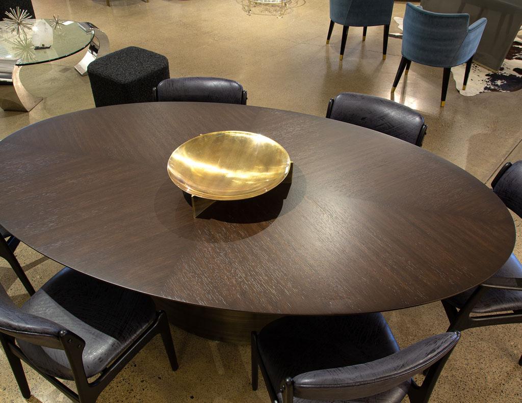 https://a.1stdibscdn.com/modern-oval-oak-dining-table-with-curved-metal-pedestals-for-sale-picture-14/f_8849/f_347313321686592222082/DS_5218_Modern_Oval_Oak_Dining_Table_Curved_Metal_Pedestals_0014_master.jpg