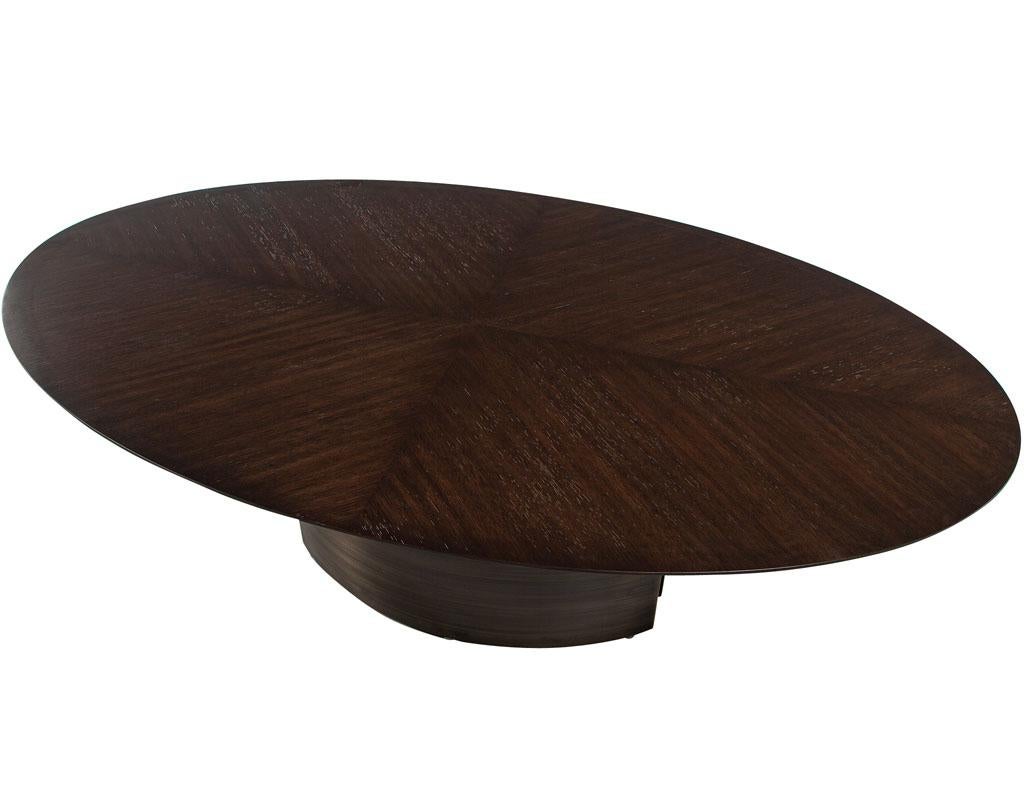 https://a.1stdibscdn.com/modern-oval-oak-dining-table-with-curved-metal-pedestals-for-sale-picture-4/f_8849/f_347313321686592221341/DS_5218_Modern_Oval_Oak_Dining_Table_Curved_Metal_Pedestals_004_master.jpg