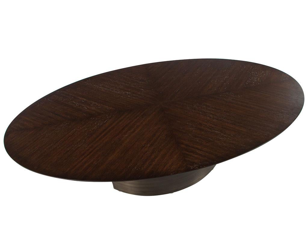 https://a.1stdibscdn.com/modern-oval-oak-dining-table-with-curved-metal-pedestals-for-sale-picture-5/f_8849/f_347313321686592221338/DS_5218_Modern_Oval_Oak_Dining_Table_Curved_Metal_Pedestals_005_master.jpg