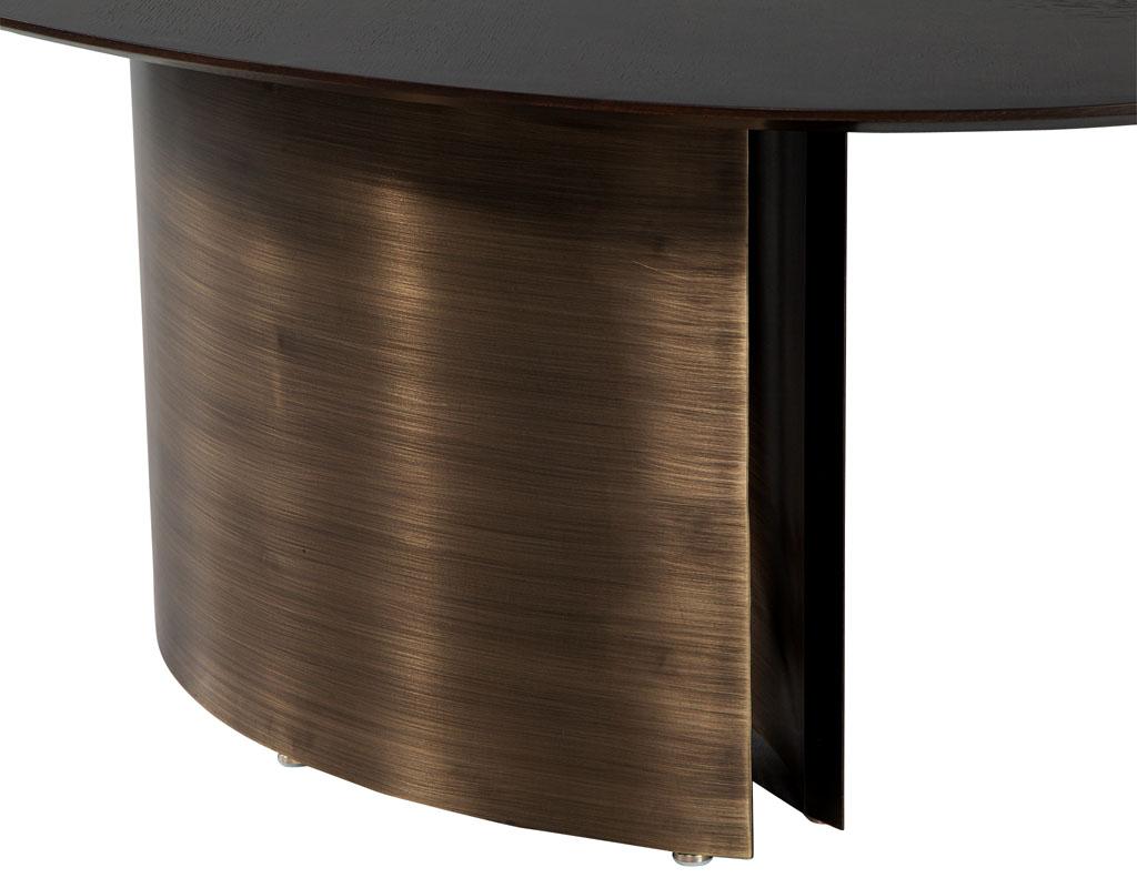 https://a.1stdibscdn.com/modern-oval-oak-dining-table-with-curved-metal-pedestals-for-sale-picture-7/f_8849/f_347313321686592221415/DS_5218_Modern_Oval_Oak_Dining_Table_Curved_Metal_Pedestals_007_master.jpg