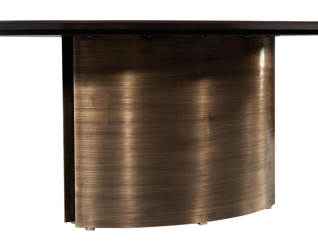 https://a.1stdibscdn.com/modern-oval-oak-dining-table-with-curved-metal-pedestals-for-sale-picture-8/f_8849/f_347313321686592221945/DS_5218_Modern_Oval_Oak_Dining_Table_Curved_Metal_Pedestals_008_master.jpg