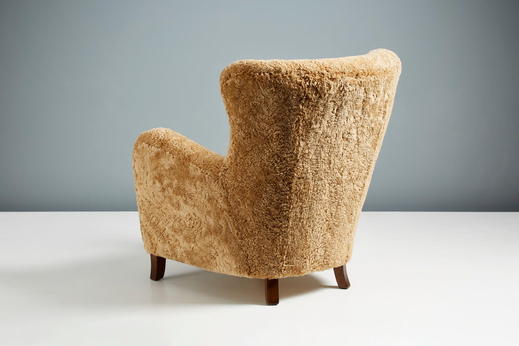 https://a.1stdibscdn.com/pair-of-custom-made-sheepskin-wing-chairs-for-sale-picture-7/f_67442/f_289525721654267832722/DagmarCustom_DD_006_SampoChair_Sheepskin_Maple_17_master.jpg