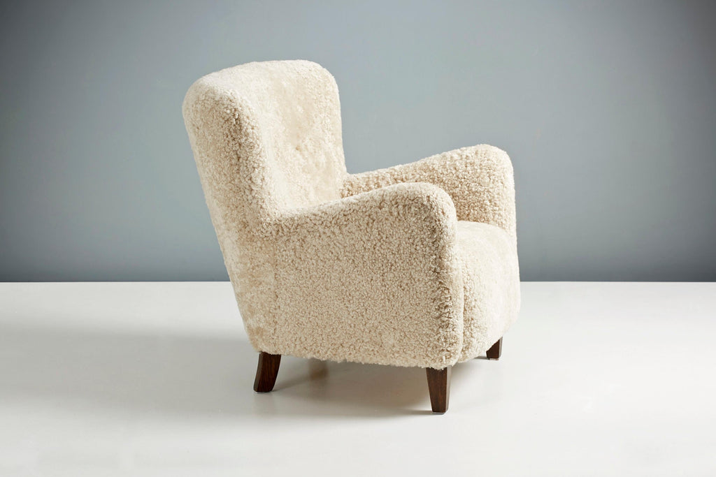 https://a.1stdibscdn.com/custom-made-ryo-sheepskin-lounge-chair-for-sale-picture-4/f_67442/f_289408121654196675765/DagmarDesign_DD_004HHLowChair_Moonlight_Fumed_Oak_32_copy_master.jpg