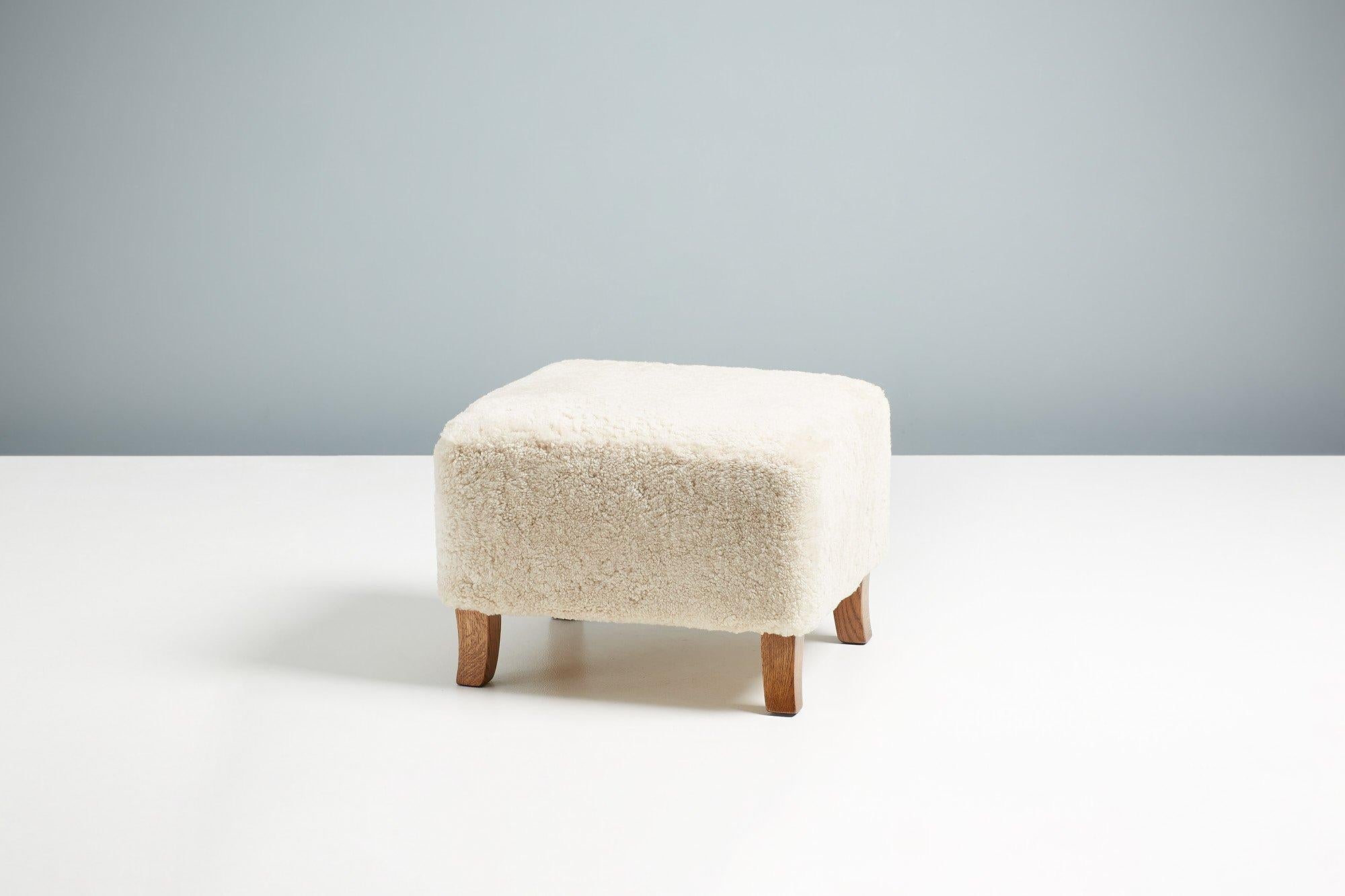 https://a.1stdibscdn.com/sheepskin-sampo-chair-ottoman-for-sale-picture-4/f_13332/f_362756921695397167123/DagmarDesign_SampoChair_Ottoman_Moonlight_22_master.jpg