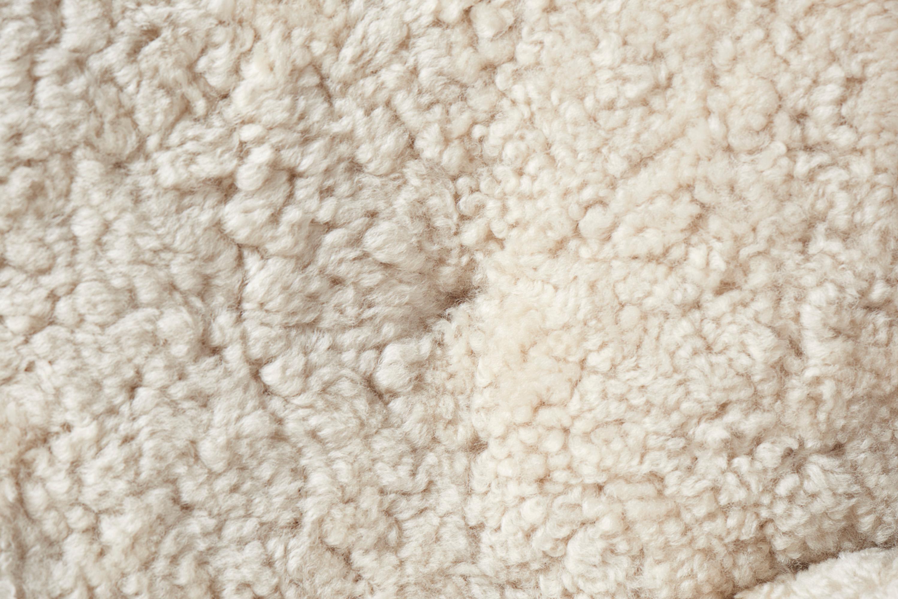https://a.1stdibscdn.com/custom-made-sheepskin-karu-sofa-by-dagmar-for-sale-picture-4/f_13332/f_431187721736615653847/Dagmar_Karu_Sofa_155W_SK_Moonlight_Detail_2_master.jpg