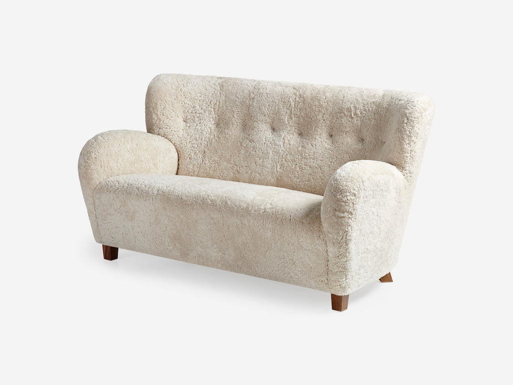 https://a.1stdibscdn.com/custom-made-sheepskin-karu-sofa-by-dagmar-for-sale-picture-5/f_13332/f_431187721736615653389/Dagmar_Karu_Sofa_155W_SK_Moonlight_Walnut_Angle_2_Wide_master.jpg